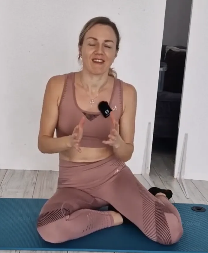 Ana demonstrating a breathing and pelvic floor coordination cue