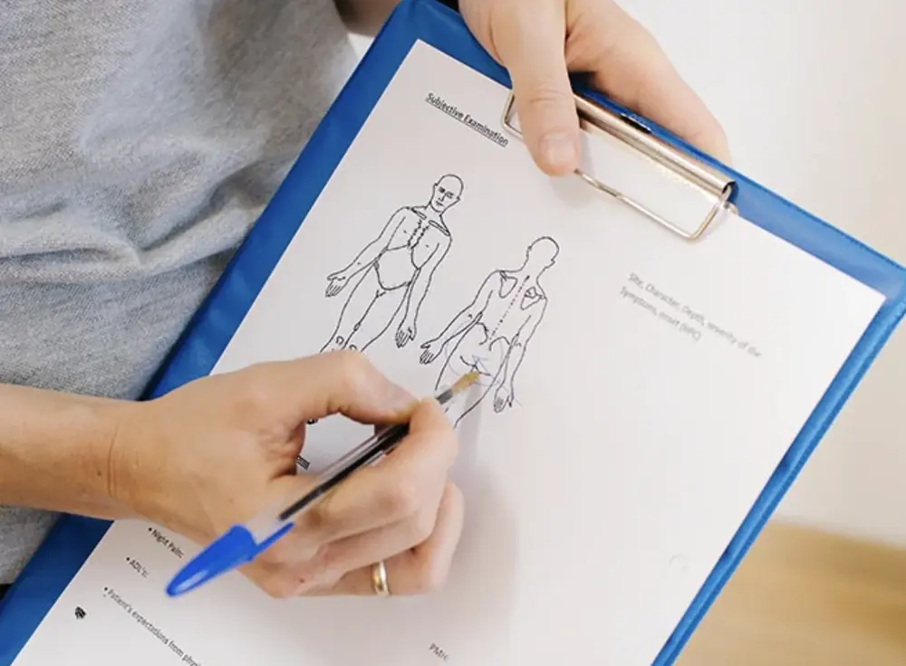 Ana completing a subjective clinical examination form