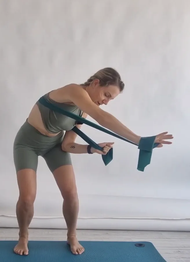 Ana demonstrating a resistance band exercise, the same pace she teaches it in clinic