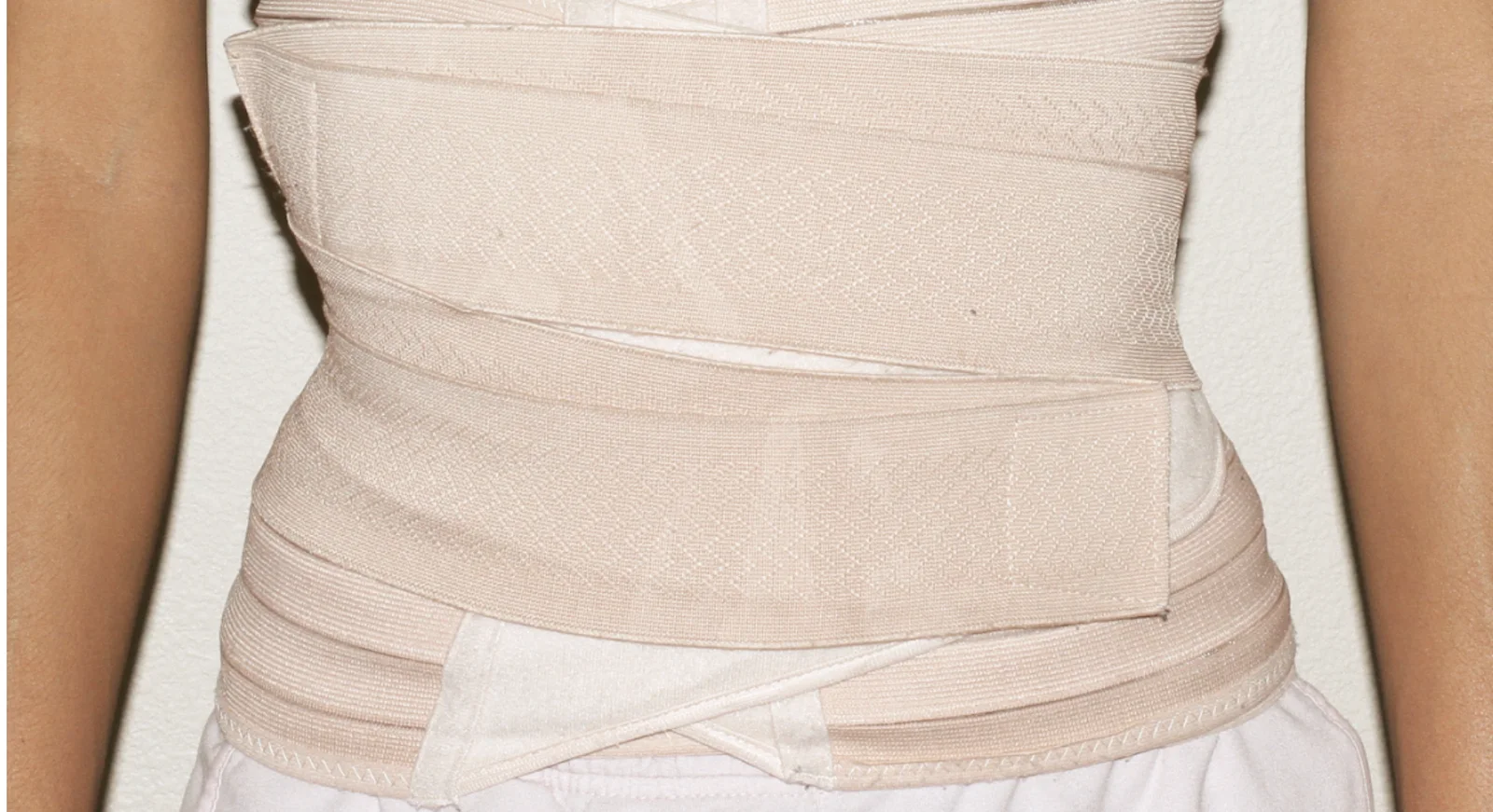 Belly Binding and Postpartum Massage: The Tradition Behind It, and What It Actually Does